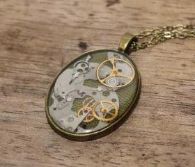 Pretty steampunk style pendant from vintage watch parts