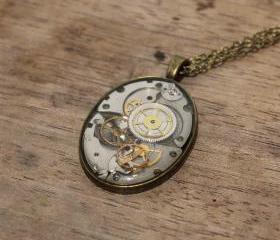 Pretty steampunk style pendant from vintage watch parts