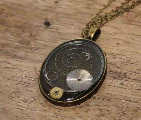 Pretty steampunk style pendant from vintage watch parts