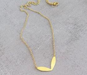 Simple dainty gold necklace, tiny raw brass leaf
