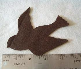 Flying bird on felt