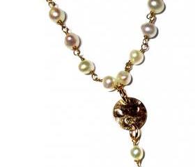 Rosary Style fresh water pearl wire wrapped necklace with a gold cross