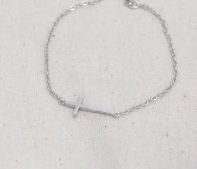 Sideways cross bracelet in white gold