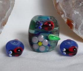 Handmade Glass Lampwork bead - Lady beetle and flowers