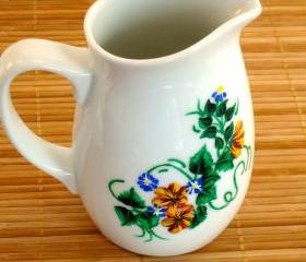 White Pitcher With Yellow Flowers