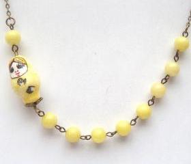 Antiqued Brass Lemon Jade Porcelain Matryoshka Necklace