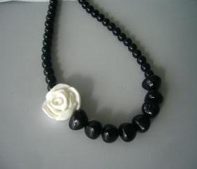  Black necklace with a white rose