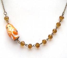 Antiqued Brass Yellow Quartz Porcelain Matryoshka Necklace