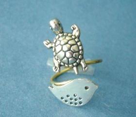 Silver turtle ring with a bird, wrap ring