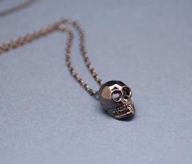 Cute Tiny Baby Skull Necklace in gunmetal