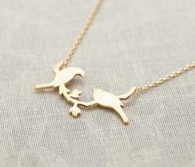 bird on a branch necklace in gold