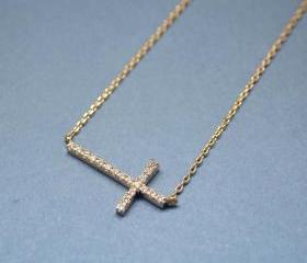 SWAROVSKI SIDEWAYS CROSS NECKLACE IN GOLD