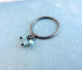 Oxidized sterling silver charm ring with blue aquamarine gemstones.