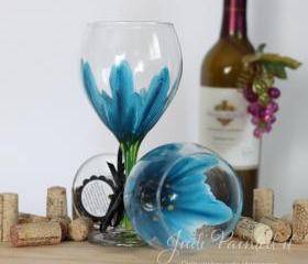 Wild flower painted wine glass in cerulean blue that is dishwasher safe 