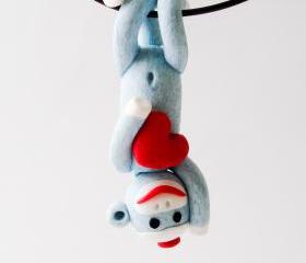 Blue Sock Monkey Pendant Swinging Upside Down holding a Valentine's Day Heart 